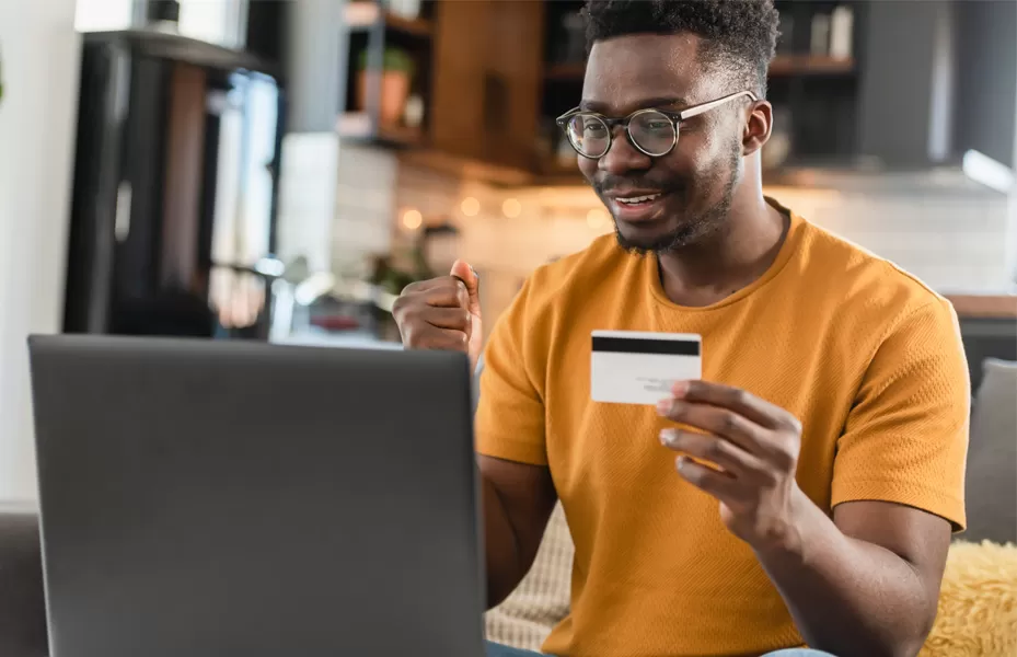 Man holding Debit Card