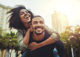 Man holding a woman on his back